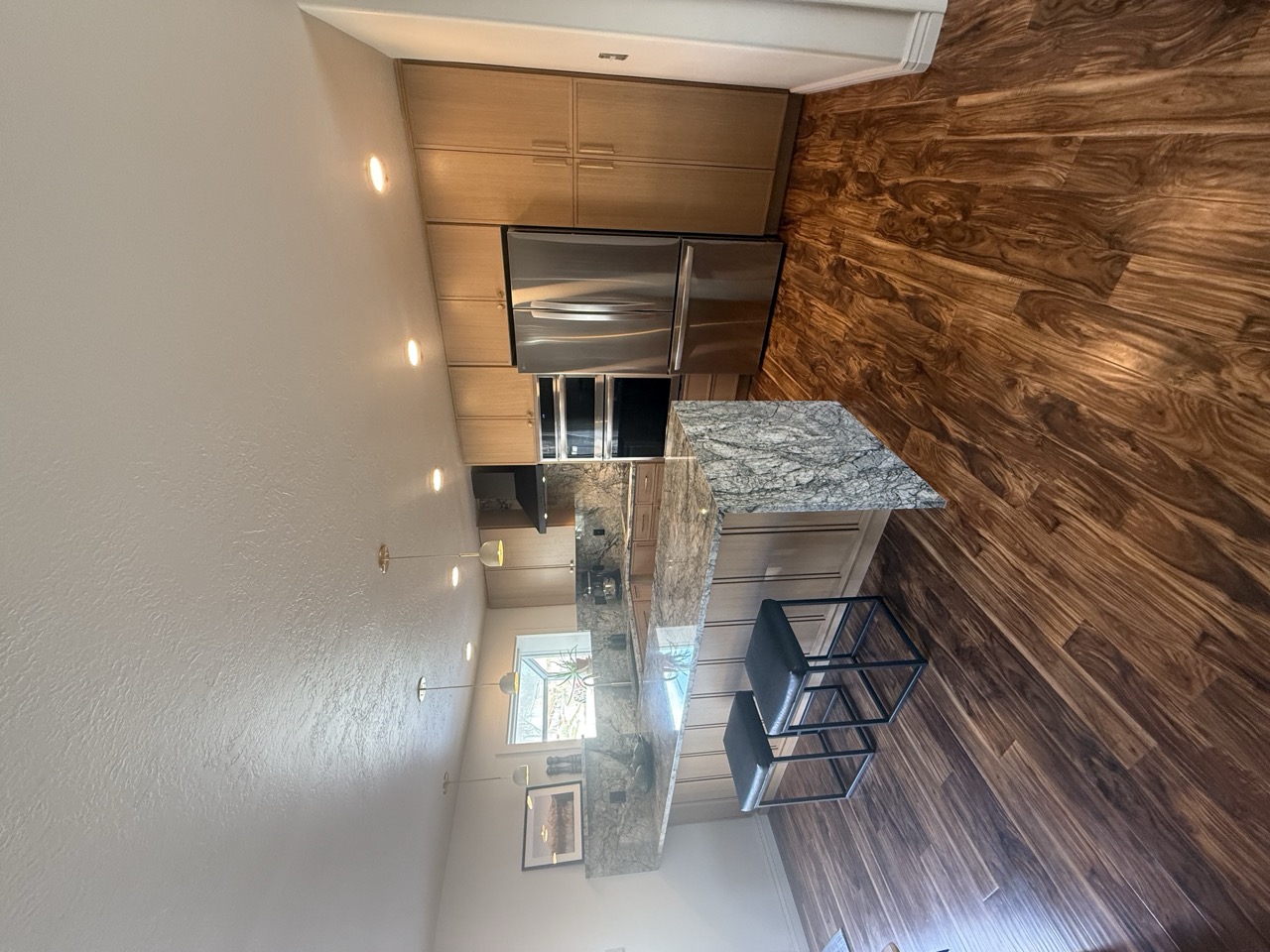 Remodeled kitchen with natural oak cabinets and granite countertops - after renovation by Salt City Cabinet