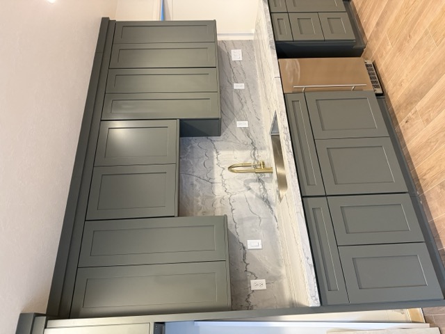 Custom kitchen cabinetry with glass panel doors